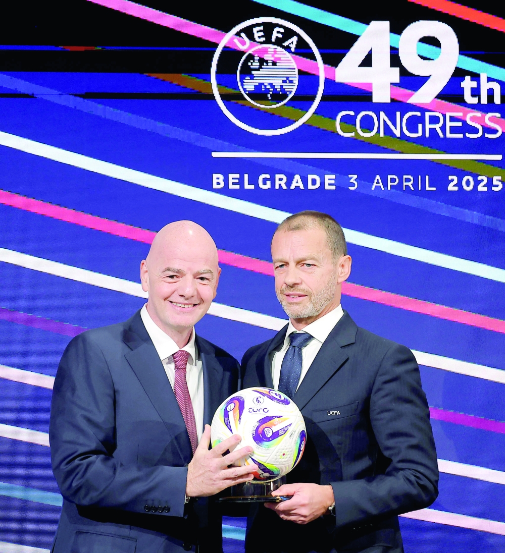 President of FIFA Gianni Infantino (L) and UEFA president Aleksander Ceferin (R) pose during the 49th UEFA ordinary Congress held at the “Sava Centar” congress centre in Belgrade on April 3, 2025. (Photo by PREDRAG MILOSAVLJEVIC / AFP)