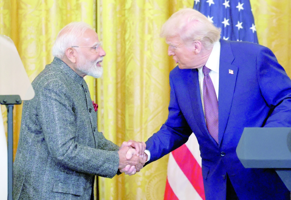 US President Donald Trump and Indian Prime Minister Narendra Modi shake hands as they attend a joint press conference at the White House in Washington, DC. - Reuters File