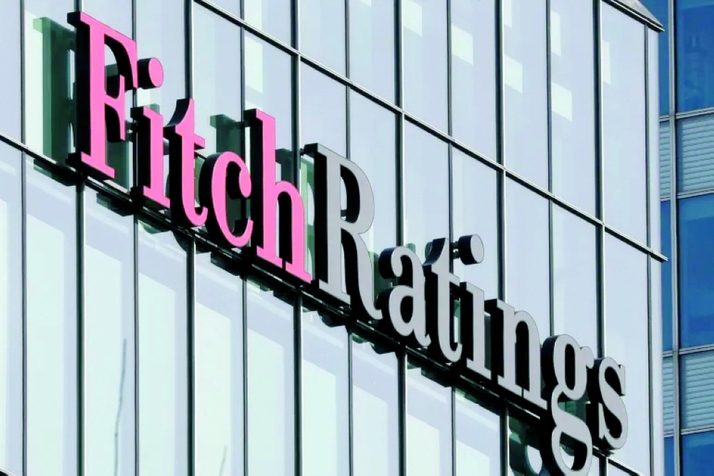Fitch cuts China credit rating on debt risks