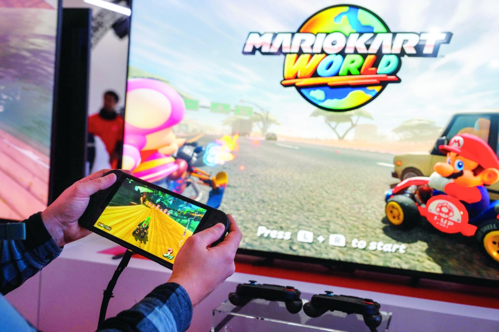 A guest plays Mariokart World with the new Nintendo Switch 2 video-game console system of Nintendo in Paris. — AFP