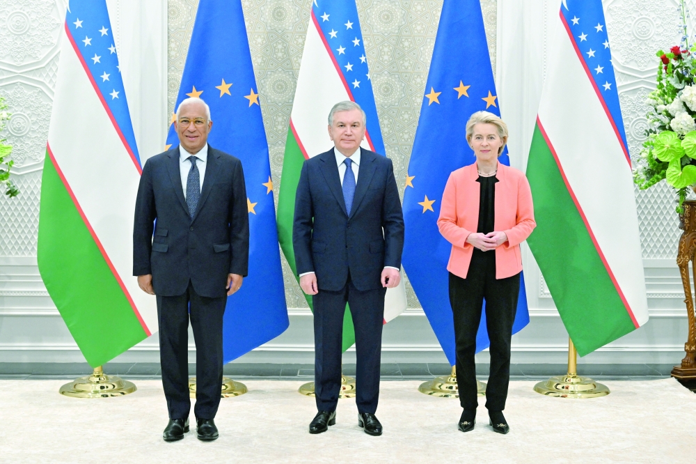 Uzbekistan's President Shavkat Mirziyoyev (C) poses for pictures with European Council President Antonio Costa (L) and European Commission President Ursula Von der Leyen (R), in Samarkand. — Reuters