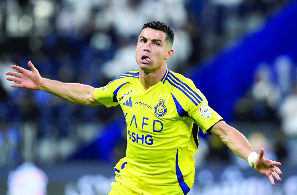 Al Nassr's Cristiano Ronaldo celebrates scoring their second goal. — Reuters