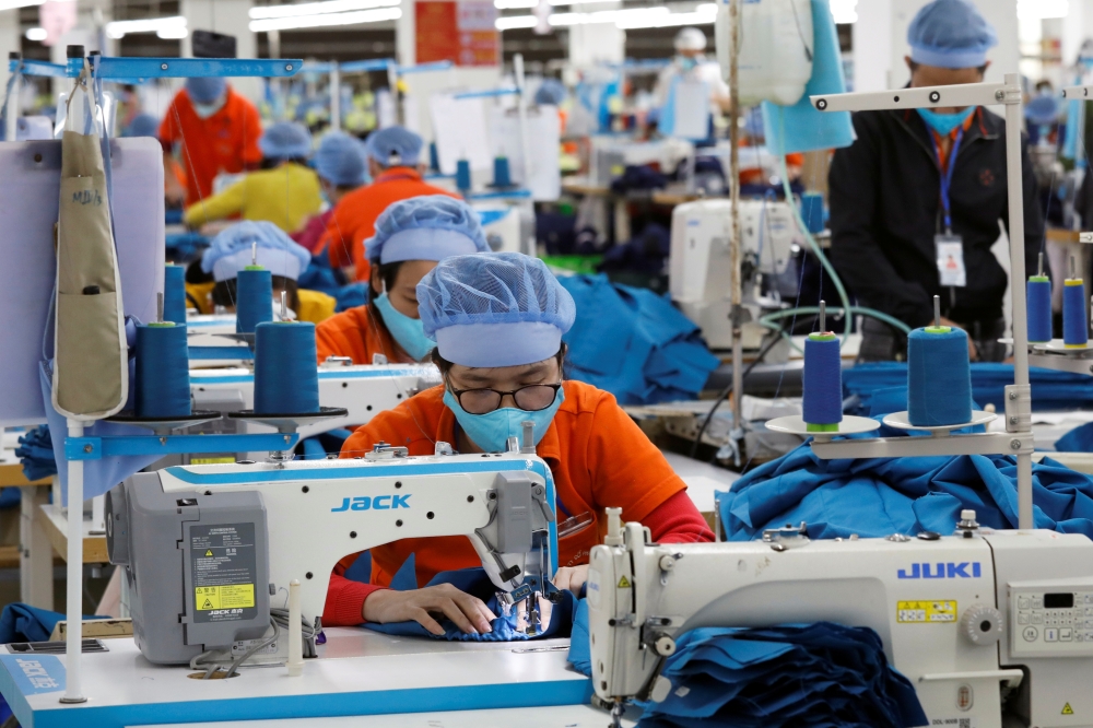 Labourers work at a garment export factory in Hung Yen province, Vietnam. — Reuters
