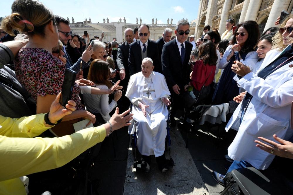 Pope Francis appears for the first time since his return to the Vatican, in Saint Peter's square. — Reuters