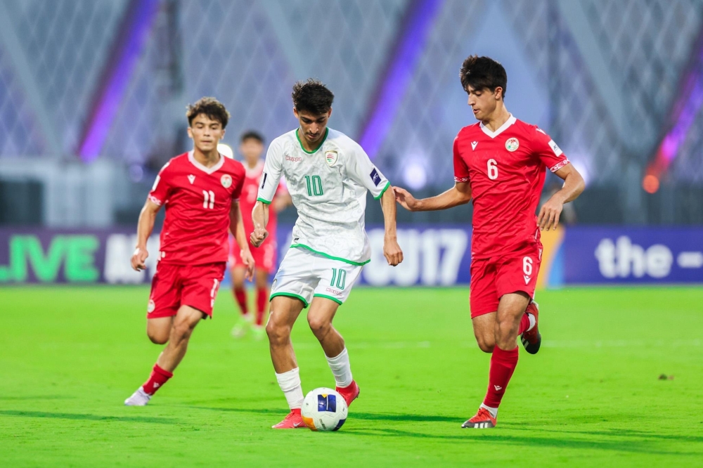 Oman and Tajikistan players in action