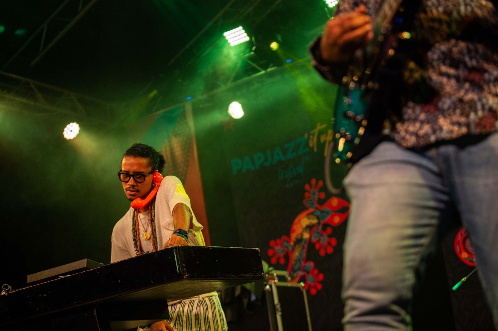 Haitian DJ KOLO performs during the PapJazz International Jazz Festival at the Karibe Hotel in Port-au-Prince, Haiti, on April 6, 2025. Residents of Haiti's gang-plagued capital Port-au-Prince could enjoy a brief escape from daily lives scarred with violence this weekend as the PapJazz festival entertained around 100 music fans. (Photo by Clarens SIFFROY / AFP)
