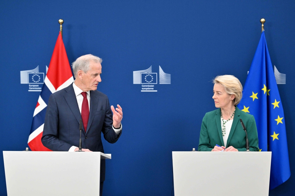 European Commission President Ursula von der Leyen listens to Norway's PM Jonas Gahr Store at the EU Commission headquarters in Brussels. — AFP