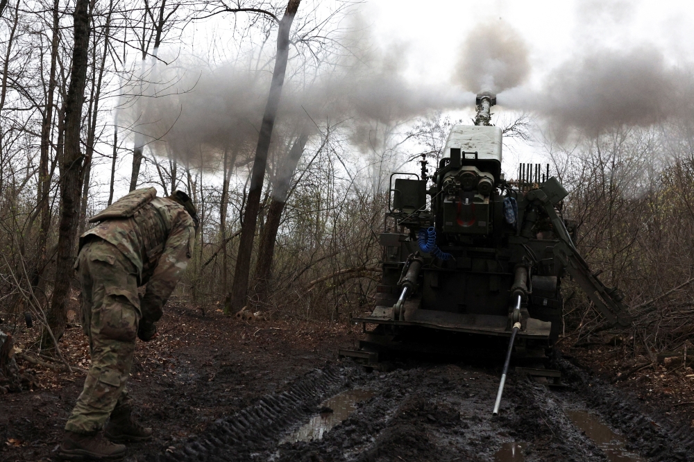 Ukrainian gunner fires towards Russian troops at an undisclosed location in the Donetsk frontline, Ukraine. — Reuters