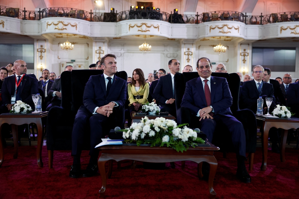 French President Emmanuel Macron and Egyptian President Abdel Fattah al-Sisi attend the closure of the Franco-Egyptian Business Forum in Cairo. — Reuters