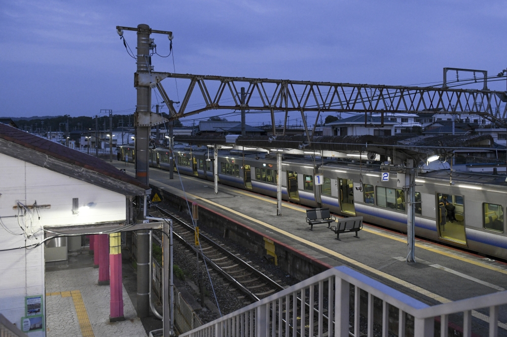 The first morning train leaving Hatsushima station after the new building, made from 3D-printed components, was assembled in Arida, Japan, on March 26, 2025. (Noriko Hayashi/The New York Times)