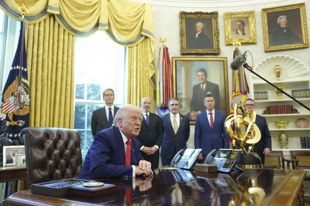 President Donald Trump speaks as he signs executive orders in the Oval Office of the White House in Washington, on Wednesday, April 9, 2025. (Eric Lee/The New York Times)