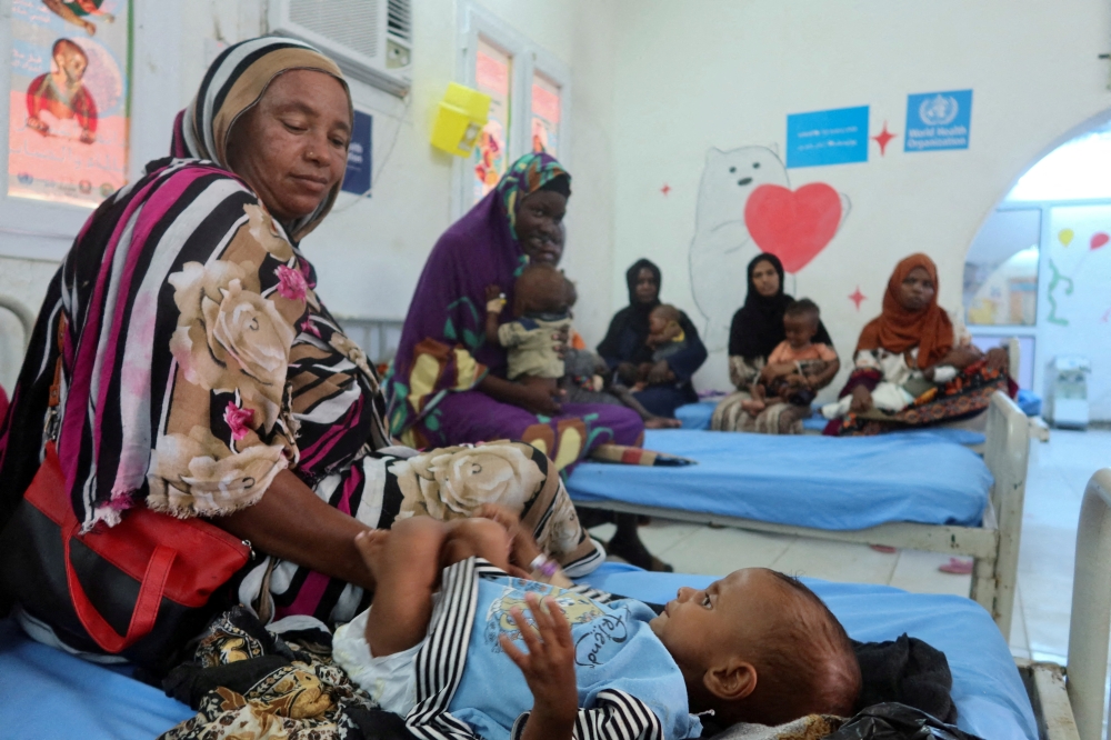 Children, suffering from malnutrition, are treated at Port Sudan Paediatric Centre, during a visit by WHO Director-General Tedros Adhanom Ghebreyesus in Sudan. - Reuters File
