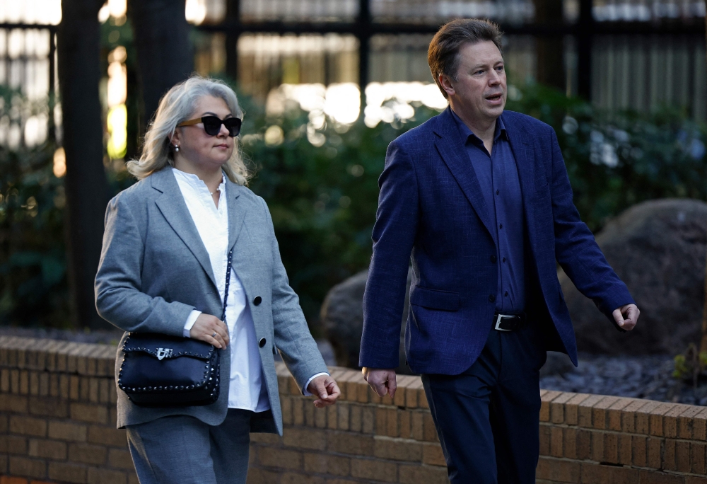 Former Russian government minister and former Mayor of Sevastopol, Dmitrii Ovsiannikov, and his wife Ekaterina Ovsiannikova arrive at Southwark Crown Court, in south London, on April 7, 2025 to attend a trial in which they are charged with breaching sanctions. (Photo by BENJAMIN CREMEL / AFP)