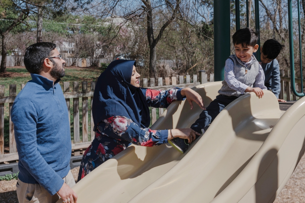 Khadija Zaidi-Rashid at a playground with her family in Centreville, Va., March 21, 2025. (Caroline Gutman/The New York Times)