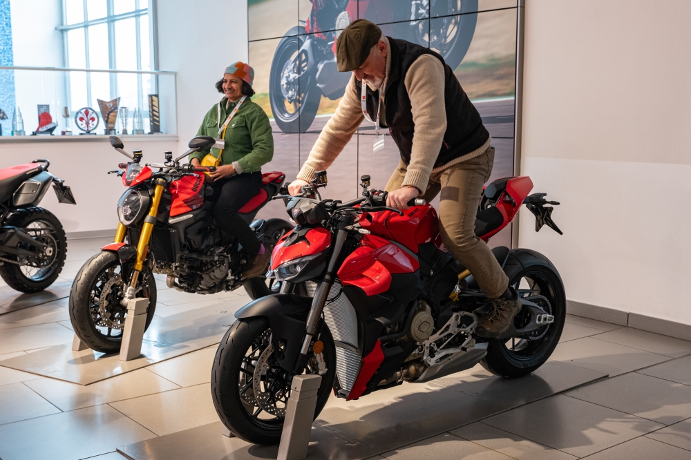 Visitors sit on motorcycles at the Ducati Museum in Bologna, Italy, in February 2025. (Federico Borella/The New York Times)