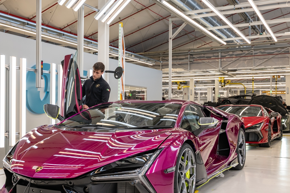 A worker tests one of the cars distinctive scissor doors at the Lamborghini factory in Sant'Agata Bolognese, Italy, in February 2025. (Federico Borella/The New York Times)