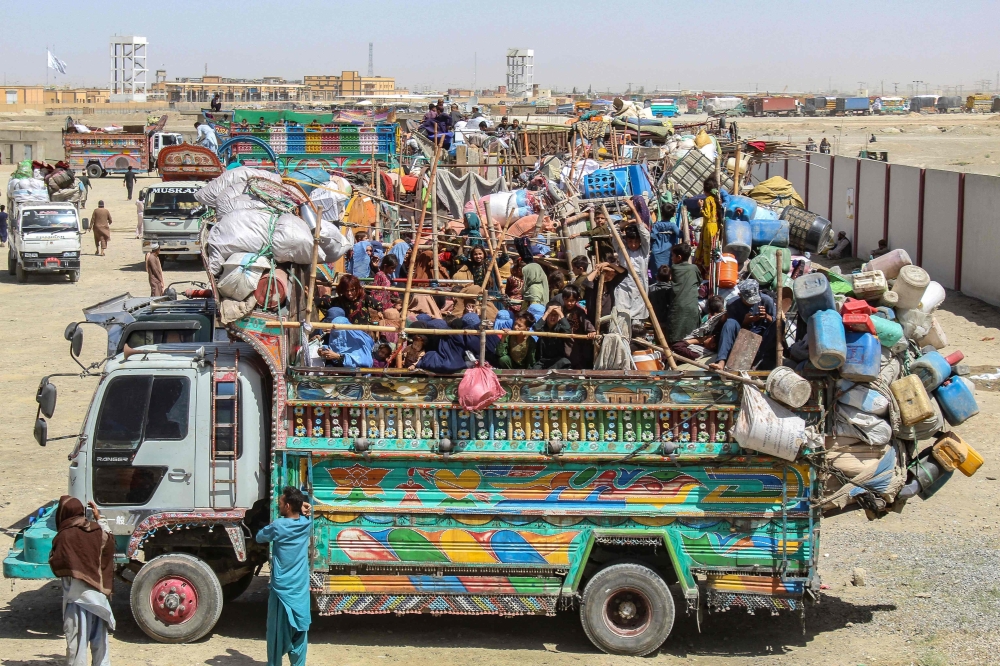 A truck with Afghan refugees waits to depart for Afghanistan near the Pakistan-Afghanistan border. — AFP