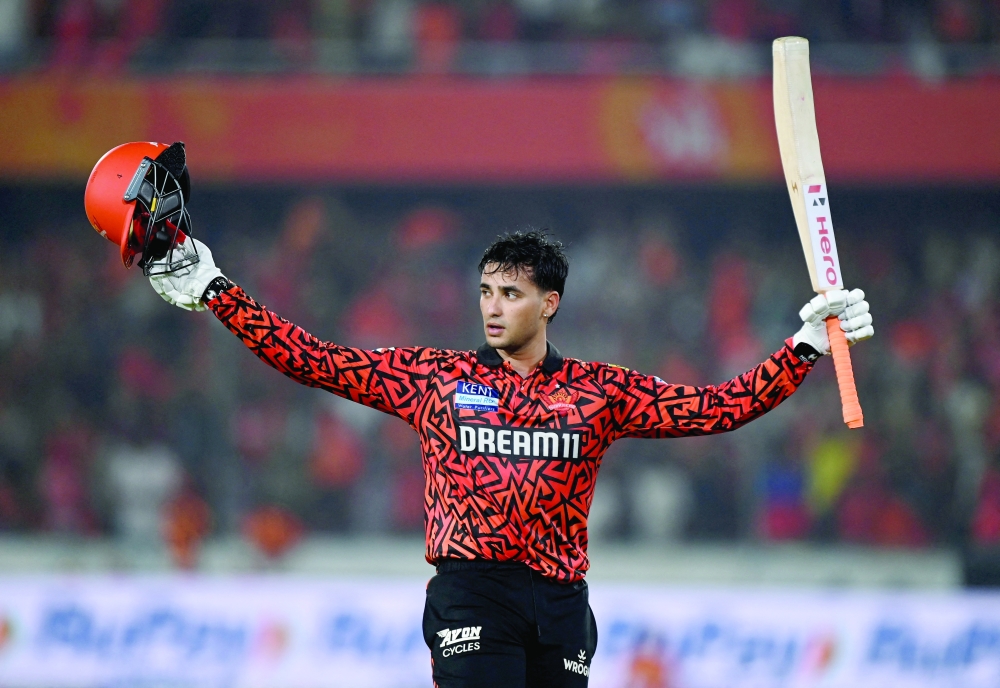 Sunrisers Hyderabad's Abhishek Sharma acknowledges fans as he walks after losing his wicket for 141 runs. — Reuters