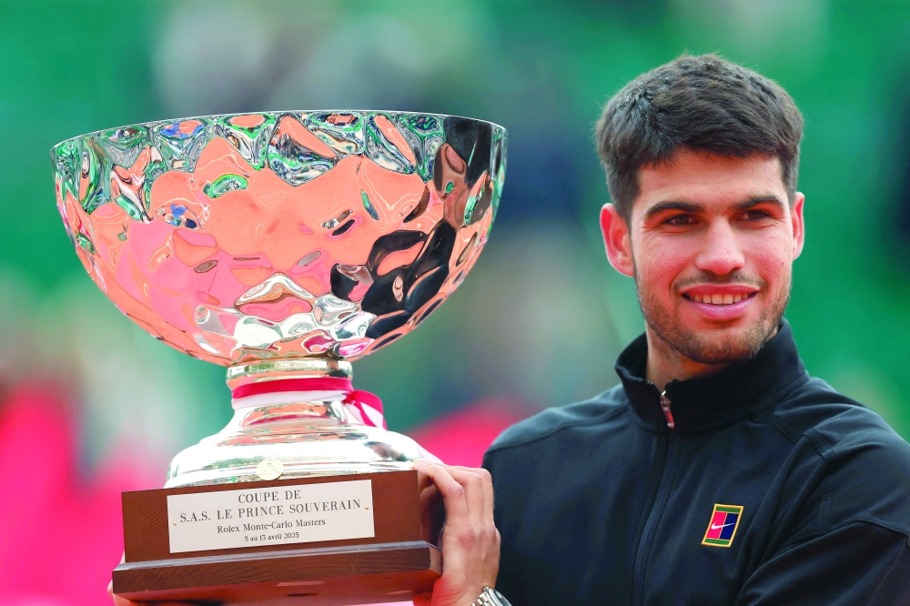 Spain's Carlos Alcaraz celebrates with the trophy after winning the Monte Carlo Masters. — Reuters