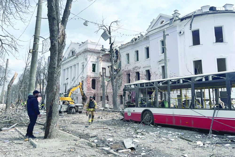 Ukrainian law enforcement officers work at the site of a missile attack in Sumy, northeastern Ukraine. — AFP