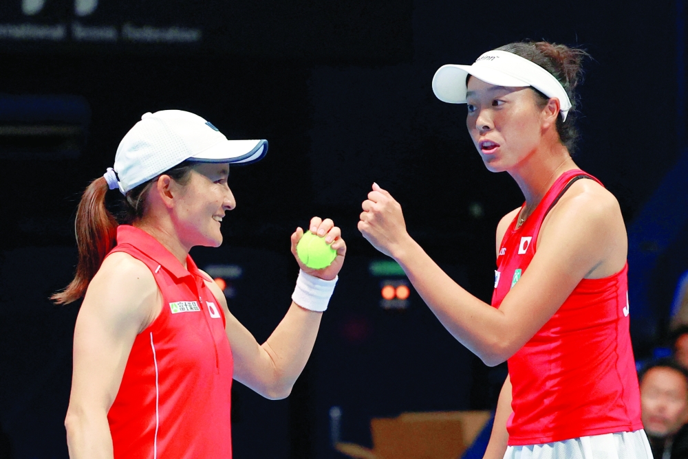 Japan's Ena Shibahara and Shuko Aoyama react during their doubles match against Canada's Rebecca Marino and Kayla Cross REUTERS/Kim Kyung-Hoon