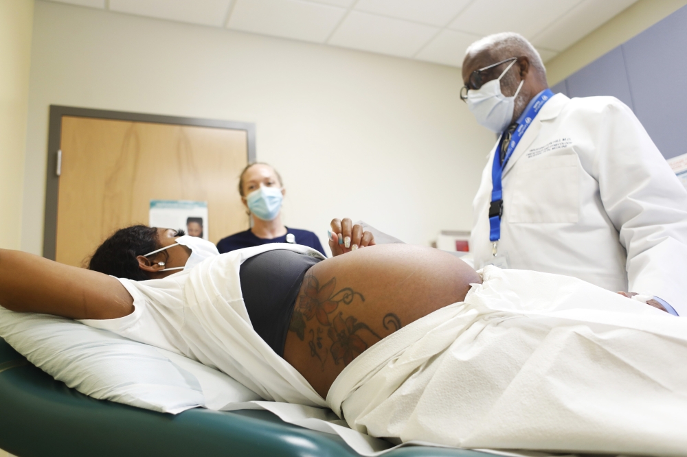A patient who is pregnant with her first child at the CenterPlace Health medical clinic in Sarasota, Fla., Feb. 14, 2022.  (Octavio Jones/The New York Times)