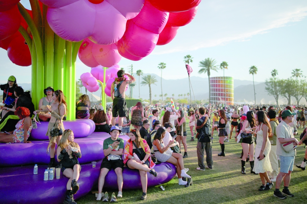 FILE PHOTO: People attend the Coachella Valley Music and Arts Festival in Indio, California, U.S., April 12, 2025. REUTERS/Daniel Cole/File Photo