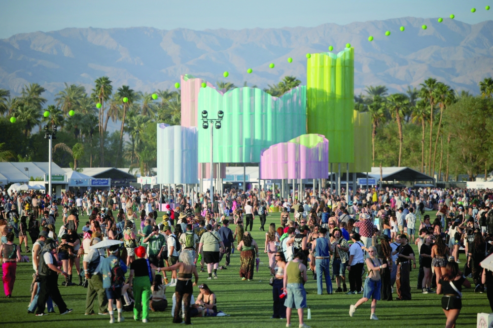 FILE PHOTO: People attend the Coachella Valley Music and Arts Festival in Indio, California, U.S., April 12, 2025. REUTERS/Daniel Cole/File Photo