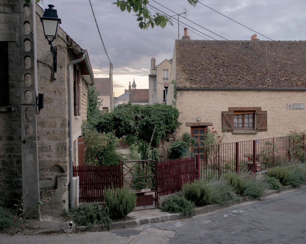 A gated courtyard in Auvers-sur-Oise, France, where Vincent Van Gogh spent his final days, on July 26, 2020 (Elliott Verdier/The New York Times)
