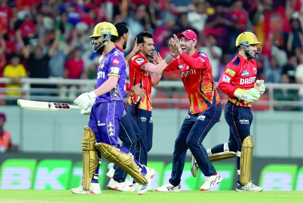 Punjab Kings' Yuzvendra Chahal celebrates with Marco Jansen after taking the wicket of Kolkata Knight Riders' Rinku Singh. — Reuters