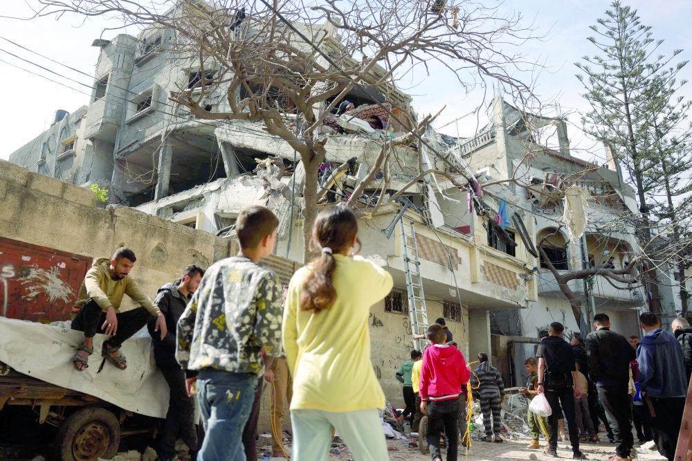 Palestinians check the damaged following overnight Israeli strikes on a residential neighbourhood in Jabalia's southwestern district of Nazla in the northern Gaza Strip. — AFP