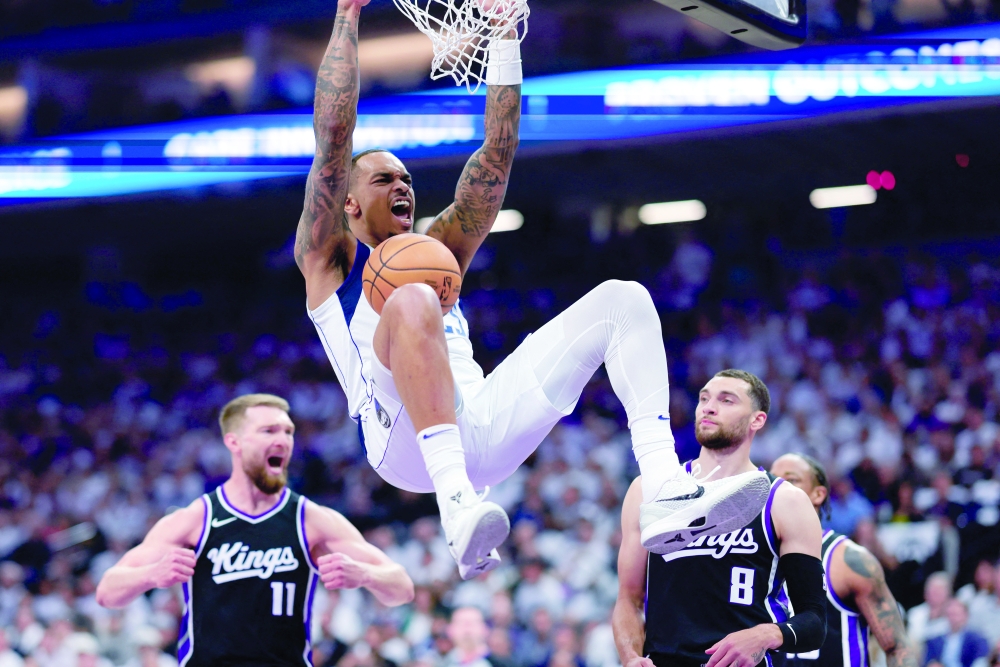 Dallas Mavericks forward PJ Washington (25) dunks the ball against Sacramento Kings guard Zach LaVine (8) during the first quarter at Golden 1 Center. — Reuters