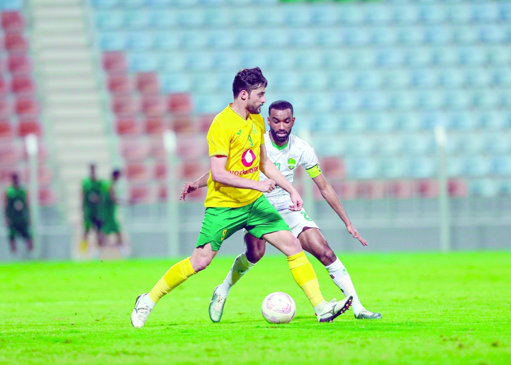 Seeb and Al Nahda players in action.