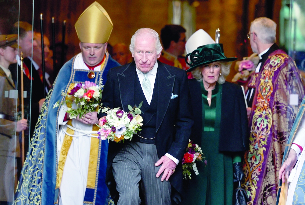 King Charles and Queen Camilla carry flowers at Durham Cathedral, Britain. — Reuters