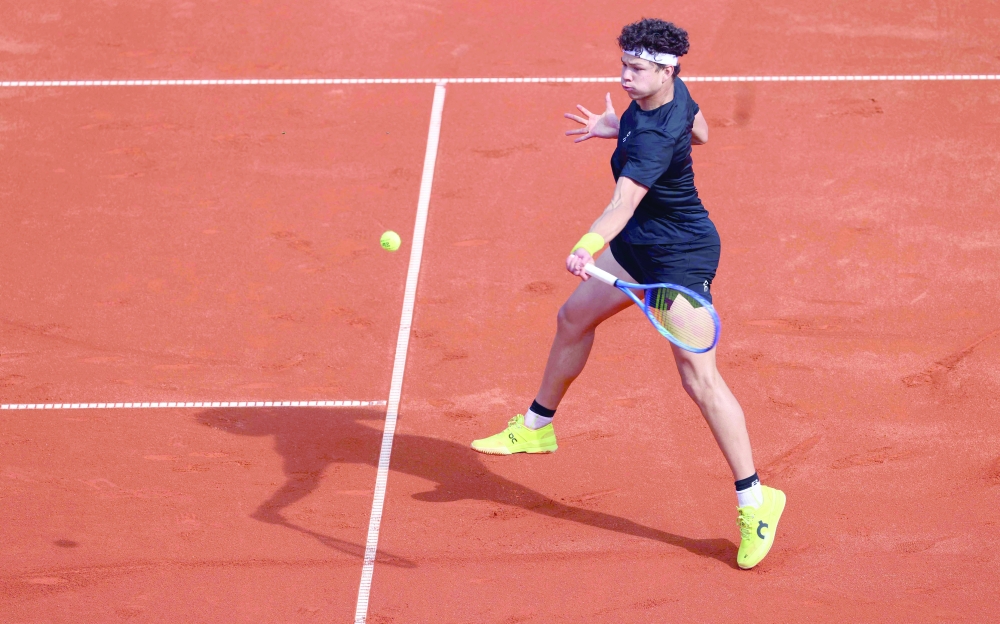 Ben Shelton of the US returns the ball to Croatia's Borna Gojo during their men's singles match of the ATP Munich Open tennis tournament in Munich, southern Germany on April 14, 2025. (Photo by Alexandra BEIER / AFP)

