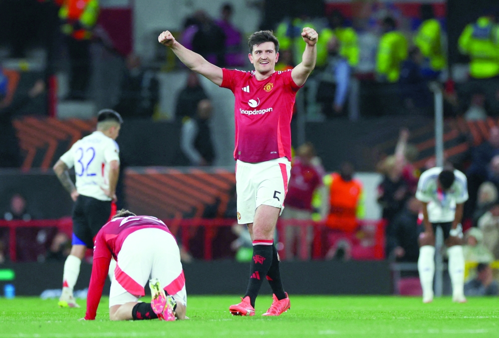 Soccer Football - Europa League - Quarter Final - Second Leg - Manchester United v Olympique Lyonnais - Old Trafford, Manchester, Britain - April 17, 2025 Manchester United's Harry Maguire celebrates after the match REUTERS/Phil Noble
