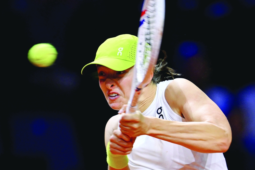 Poland's Iga Swiatek in action during her quarter final match against Latvia's Jelena Ostapenko. — Reuters