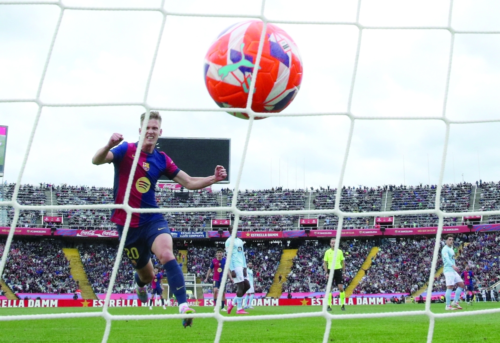 FC Barcelona's Dani Olmo celebrates after Raphinha scores their third goal. — Reuters