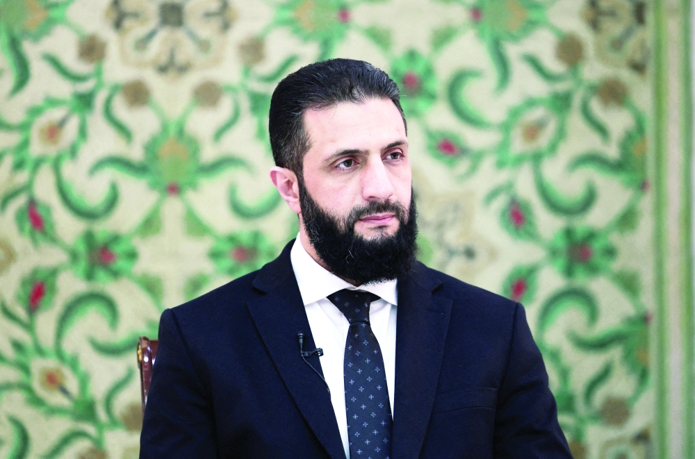 Syria’s President Ahmed al-Sharaa attends an interview at the presidential palace, in Damascus. — Reuters