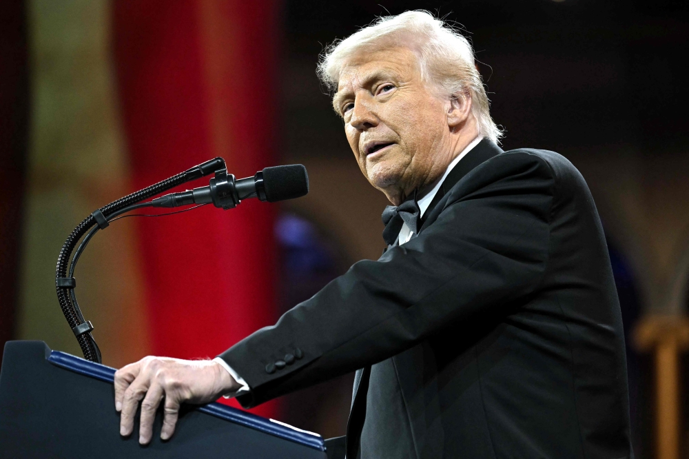 (FILES) US President Donald Trump speaks at the National Republican Congressional Committee's (NRCC) "President's Dinner" at the National Building Museum, where he remarked that "These countries are calling us up, kissing my ass," speaking about world leaders seeking to temper his sweeping tariffs, in Washington, DC on April 8, 2025.  Donald Trump's first 100 days back in the US presidency have showcased his unique ability to shock -- and sometimes entertain -- with outrageous remarks that pull no punches. From stroking his own ego to berating American allies, Trump has given many memorable quotes since he returned to the White House
 (Photo by SAUL LOEB / AFP)

