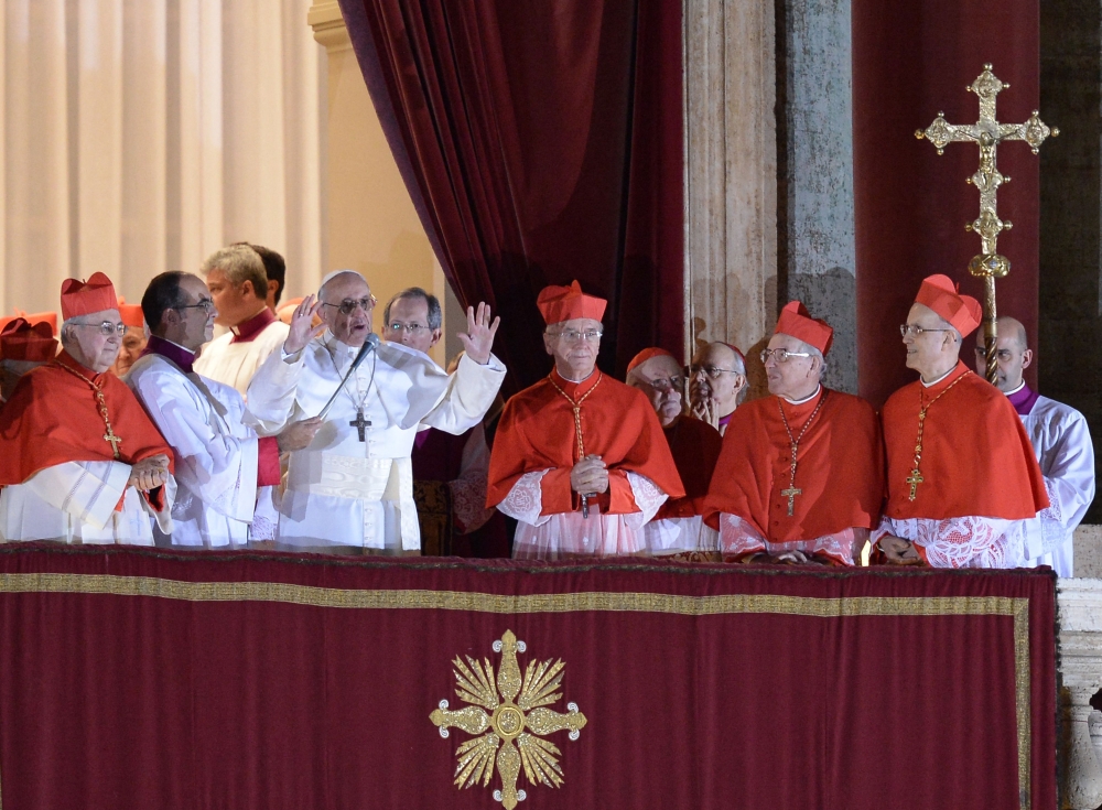 Argentina's cardinal Jorge Bergoglio, elected Pope Francis I (3rdL) addresses the crowd on the balcony of St Peter's Basilica's, at the Vatican. — AFP