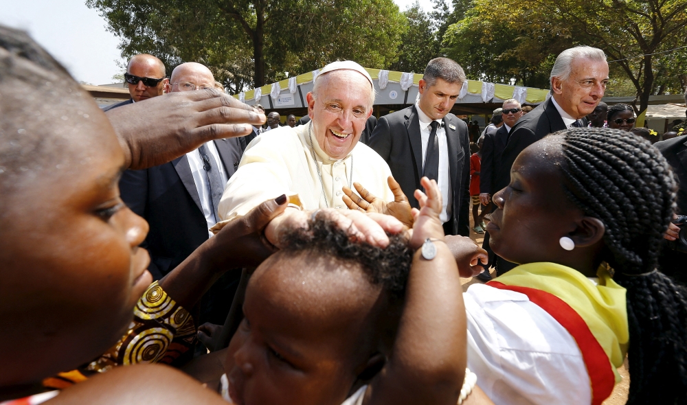 Pope Francis blesses a child as he visits the refugee camp of Saint Sauveur in Bangui, Central African Republic. — Reuters