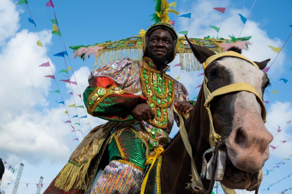 Participants parade during the Lagos Fanti Carnival, in Lagos on April 20, 2025. After Brazil abolished slavery, some of the enslaved Africans returned to West Africa, settling in several countries including Nigeria and Sierra Leone. They brought with them Latin American food, religion and colour. On Sunday thousands of descendants of the freed slaves – donned elaborate costumes at a colorful parade in Lagos to proudly keep their heritage alive. (Photo by TOYIN ADEDOKUN / AFP)
