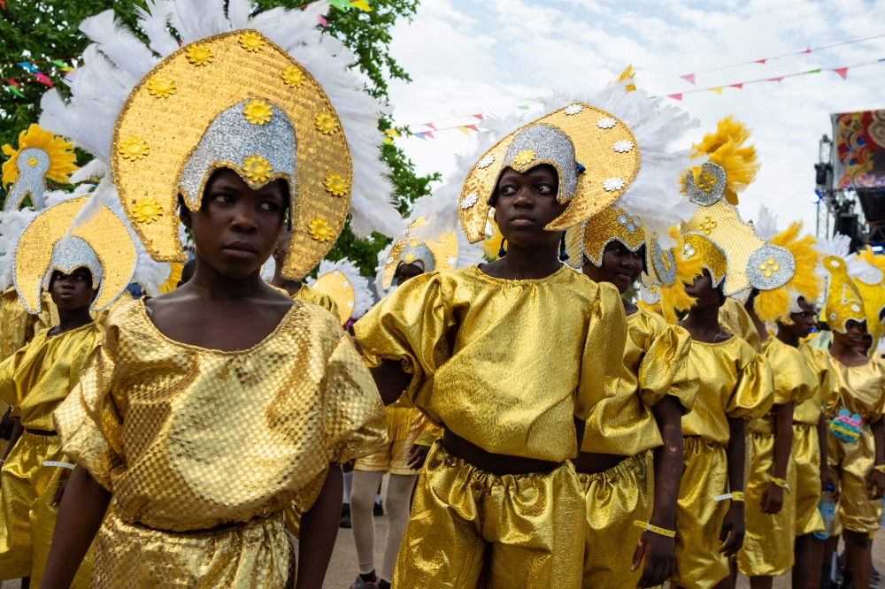Participants parade during the Lagos Fanti Carnival, in Lagos on April 20, 2025. After Brazil abolished slavery, some of the enslaved Africans returned to West Africa, settling in several countries including Nigeria and Sierra Leone. They brought with them Latin American food, religion and colour. On Sunday thousands of descendants of the freed slaves – donned elaborate costumes at a colorful parade in Lagos to proudly keep their heritage alive. (Photo by TOYIN ADEDOKUN / AFP)

