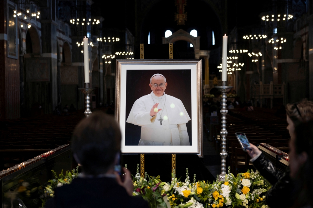 People pay tribute to Pope Francis following his death, in Westminster Cathedral in London. — Reuters