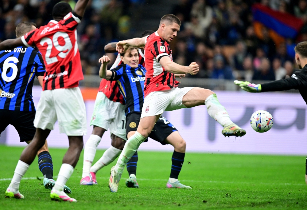 AC Milan's Luka Jovic scores their second goal. — Reuters