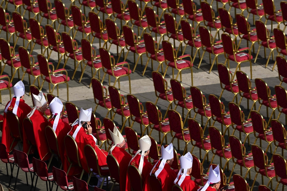 Cardinals wait at St Peter's Square before Pope Francis' funeral ceremony in the Vatican, on April 26, 2025.  (Photo by Tiziana FABI / AFP)