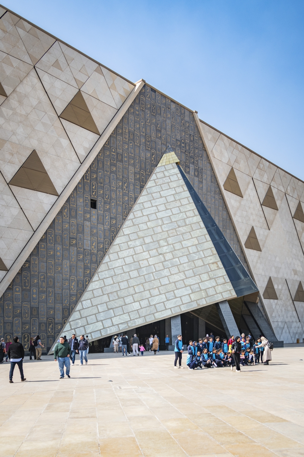 A pyramidal entryway leads to the grand atrium of the Grand Egyptian Museum in Giza, Egypt, in February 2025. (Stephen Hiltner/The New York Times)