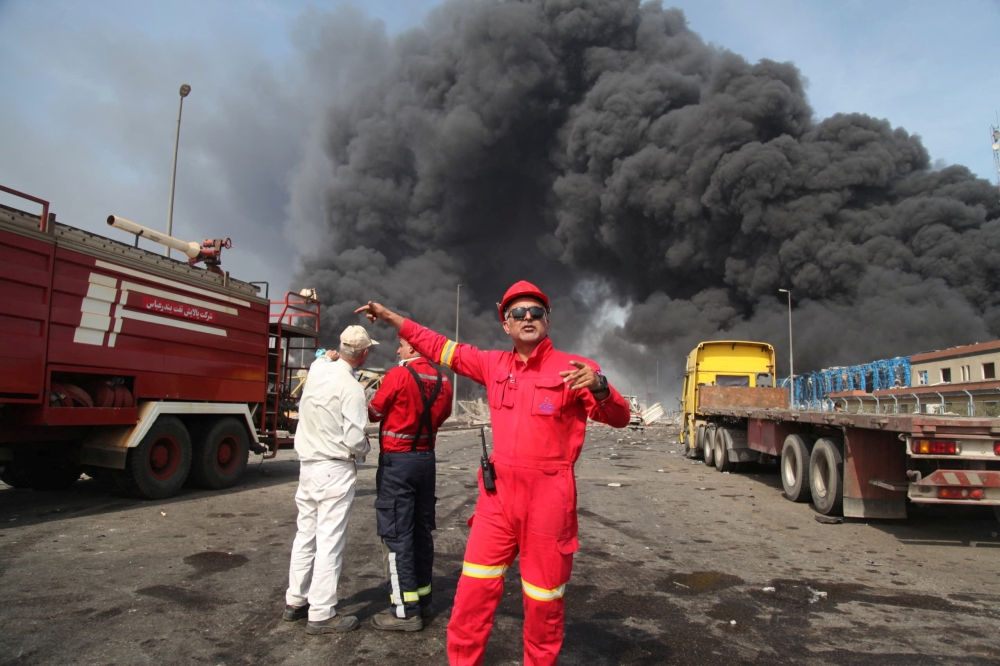 Smoke from the explosion is seen at the Shahid Rajaee port in Bandar Abbas, Iran. — Reuters