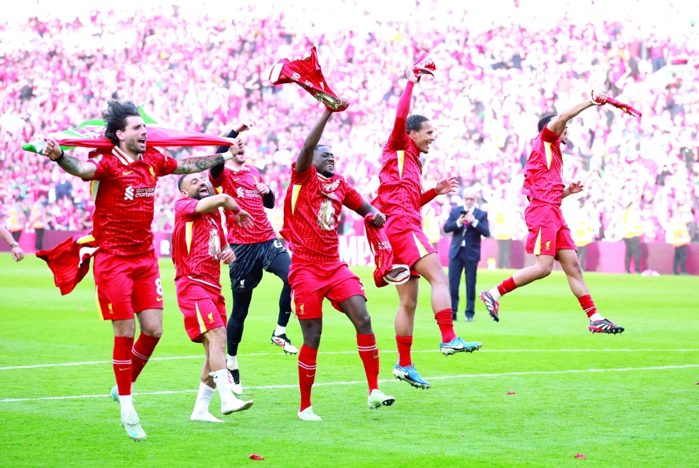 Liverpool players celebrate after winning the Premier League REUTERS